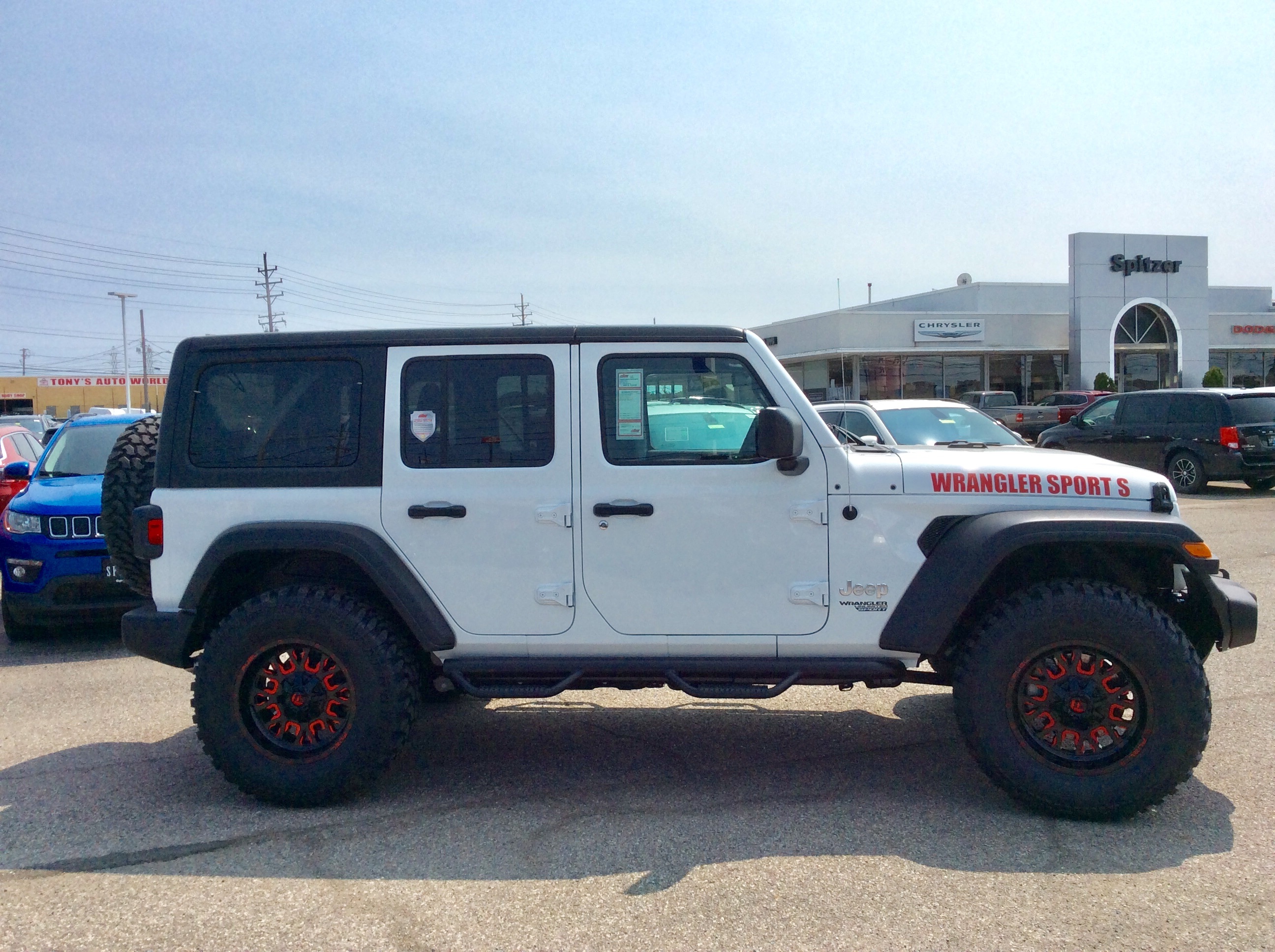 lifted JK Wrangler 2014 Dune color with Atlas bumpers from DSI